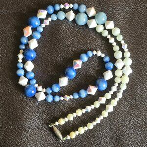 Vintage beaded necklace in varigated colours and shapes and materials.